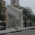 Modern Full View Glass Fashion Store Showcases Along Vibrant Downtown Commercial Shopping Street