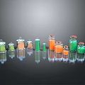 Assorted Glass Bottles With Green And Orange Liquid And Stoppers In Various Sizes