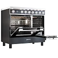 Black Freestanding Double Oven Kitchen Appliance With Knob Controls And Open Doors