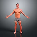 Shirtless Man With Arm Tattoos Standing In Gray Shorts And Arms Outstretched Against Gray Background