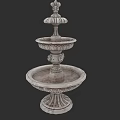 Park Landscape Featuring Ornate Three Tiered Stone Fountain With Sculpted Base And Intricate Design Elements