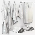 Light Brown Textured Towels Hanging On Wall With Rolled Towels And Soft Finish