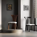 Two Brown And Black Wooden Chairs With Patterned Cushions Grey Wall Decorative Paintings Interior