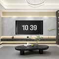 Modern Living And Dining Room With Gray TV Wall Black Coffee Table Green Plant And Gray Tones