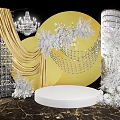 Elegant Floral Art Display Featuring Yellow Circular Backdrop White Florals Crystal Chandelier and Marble Base