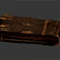 Antique Leather Book Sculpture With Intricate Carved Metal Decorations And Worn Details