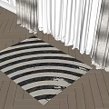 Square Rug With Black And White Stripes On Wooden Floor Near Curtains In Natural Light