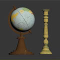 Vintage Globe With Brown Base And World Map Next To Golden Ornate Candle Holder