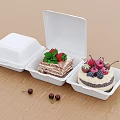 Delicious Cakes In White Food Containers Topped With Strawberries Mint And Cherries On Wooden Tabletop