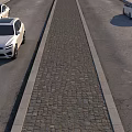 Classic Cobblestone Central Median Separating Two Durable Asphalt Road Lanes For Daily Passenger Vehicle Travel