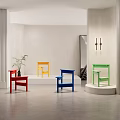 Colorful Single Chairs in Modern Minimalist Interior Displayed on White Pedestals