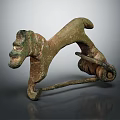 Ancient Bronze Dog Shaped Harness Fitting With Carved Details And Rustic Patina