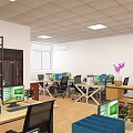Modern Public Office Space With Open Layout Wooden Shelves And Green Plants