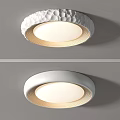 Modern Round Ceiling Light with Textured and Smooth White Surface and Soft Illuminated Design 3d model