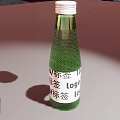 Transparent Green Glass Beverage Bottle with Label and Logo on Light Background