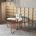 Round Glass Top Side Table with Copper Metal Frame in Modern Perforated Wall Interior