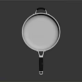 Stainless Steel Frying Pan With Black Handle And Shiny Reflective Surface