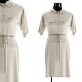 Clothes Hanger Displaying Floral Blouse Gray Skirt And Beige Dress With Waist Tie