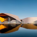 Contemporary Architectural Building With White And Yellow Geometric Design Glass Curtain Walls And Water Reflection