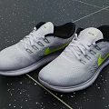 Gray Running Shoes With Yellow Accents Knitted Upper White Laces And White Sole