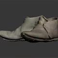 Grey Old Worn Pair of Boots Placed On Black Reflective Surface