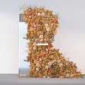 Artistic Floral Installation Featuring Warm Tones Flowers And Natural Foliage