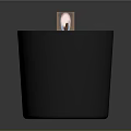 Lit Candle In Black Container With White Wax And Decorative Label