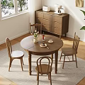 Cozy Wooden Dining Chairs Around Round Table in Bright Natural Room with Window Plants