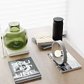 Modern Inflatable Green Vase Decor With Black Cylinder Books And Metal Stand On Wooden Table