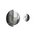Two Round Mirrors Reflecting Patterned Walls and Outdoor Views in Black and White Style