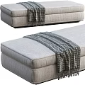 Gray Fabric Ottoman With Cozy Knitted Blanket On Top For Living Room