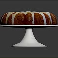 Delicious Round Bundt Cake With White Icing Drizzle On Silver Stand Against Dark Background