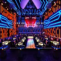 Futuristic Modern Bar Interior With Neon Lights Blue Orange Lighting And Stage Seating