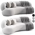 Two-seater Sofa with Soft Pillows and Gray Blanket in Modern Interior Design