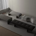 Multiple Modern Upholstered Benches In Black And White On Rug Covered Floor Interior