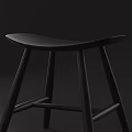 Modern Black Wooden Stool With Curved Seat And Four Legs Structure