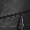 Black Bathroom Wall Rack With Hooks Hanging Gray Towel On Marble Surface 3d model