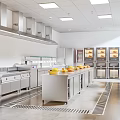 Commercial Kitchen With Stainless Steel Equipment Ovens Island Counter And Range Hoods