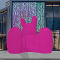 Large Pink Rabbit Sculpture In Front Of Modern Commercial Building With Alphabet Art