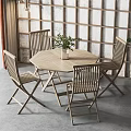 Wooden Round Dining Table and Four Chairs Set with Green Plant Against Wooden Grid Wall