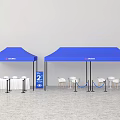 Public Facilities Setup With Blue Tents Tables Chairs Number 2 Signage And Barriers