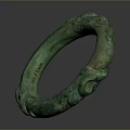 Green Circular Bronze Sculpture Featuring Intricate Decorative Carvings On Surface