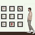 Photo Wall With Framed Sculptural Busts In Grid Arrangement On Light Colored Wall