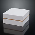 Minimalist Decorative Ornament Set With White Square Box Golden Trim And Reflection On Black Background
