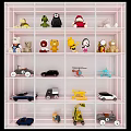 Plush Toys Displayed On White Shelf With Stuffed Animals And Various Toy Vehicles