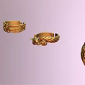 Exquisite Gold Rings With Intricate Carved Patterns On Pastel Pink Background