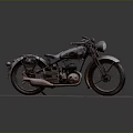 Old Vintage Motorcycle Displayed on Gray Platform with Headlight and Seat