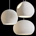 Modern White Spherical Pendant Lights With Hollow-out Pattern And Soft Lighting For Contemporary Interior Spaces