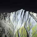 Scenic Mountain Landscape With Green Slopes Gray Rocky Peaks And Blue Lake