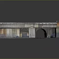 Arched Brick Underpass Area With Metal Fences Street Lamp And Curved Paved Road